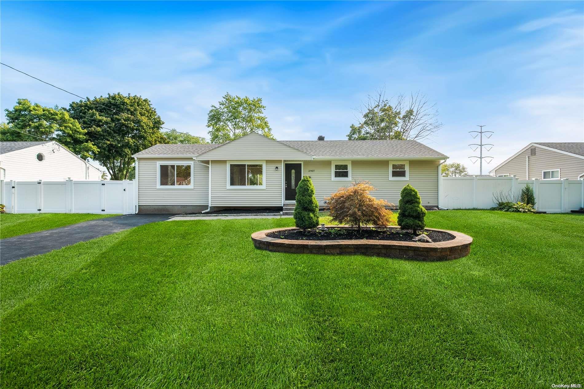 a front view of a house with a yard and porch