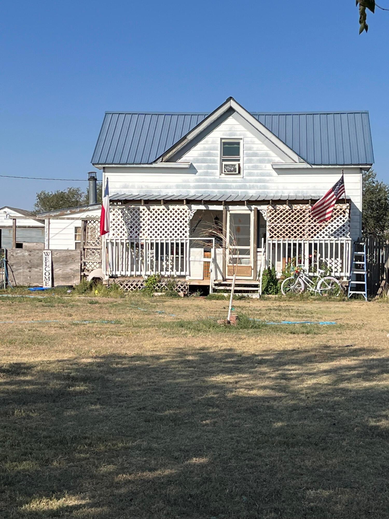 a front view of a house with swimming pool