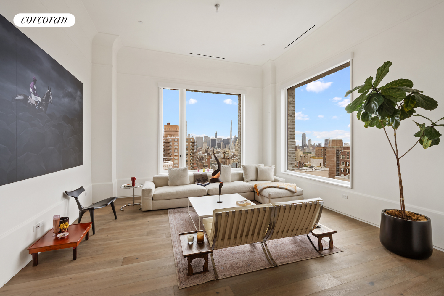 a living room with furniture and floor to ceiling window