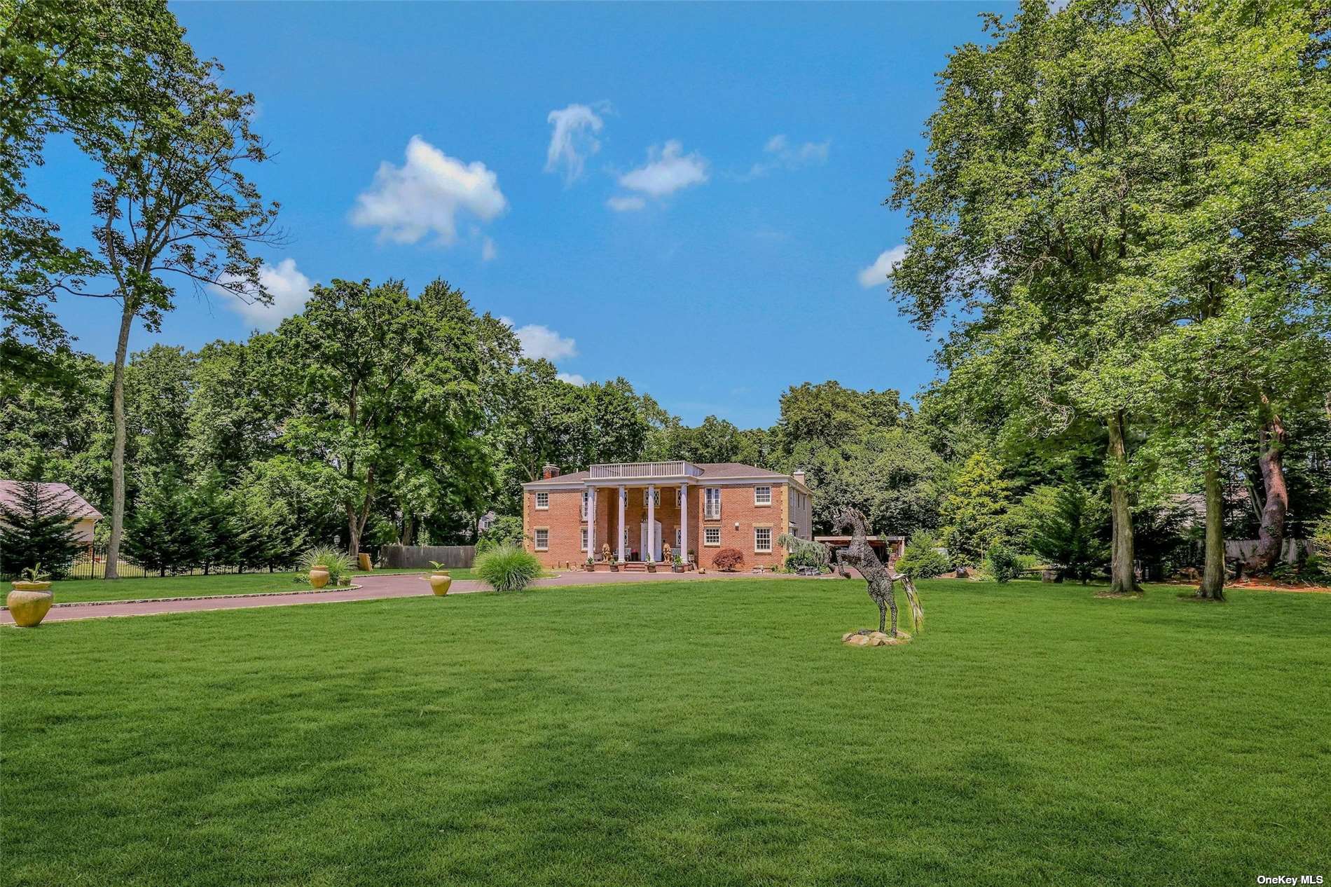 a view of house with a big yard