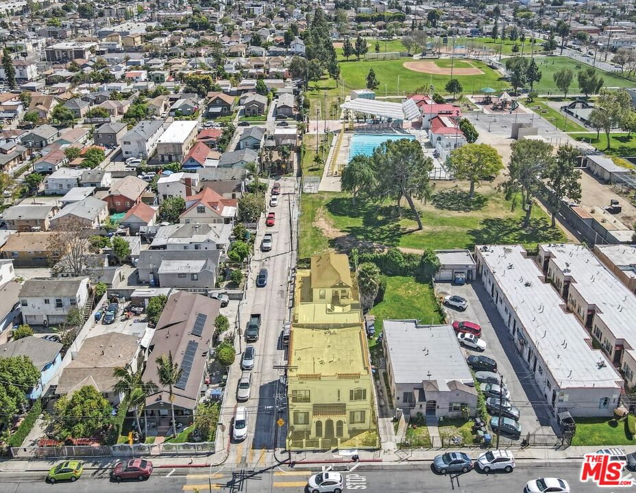 an aerial view of residential houses with outdoor space