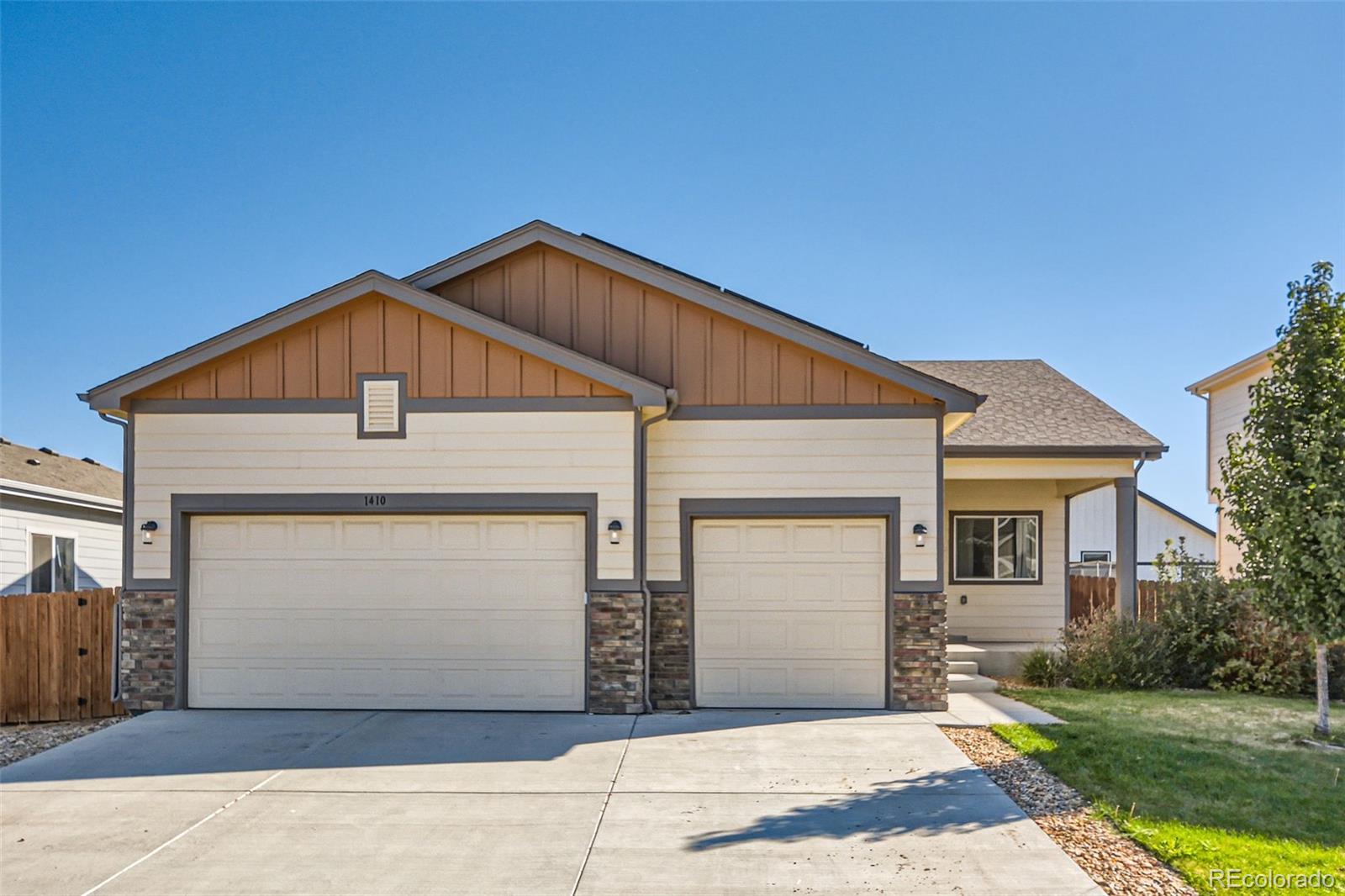 a front view of a house with garage