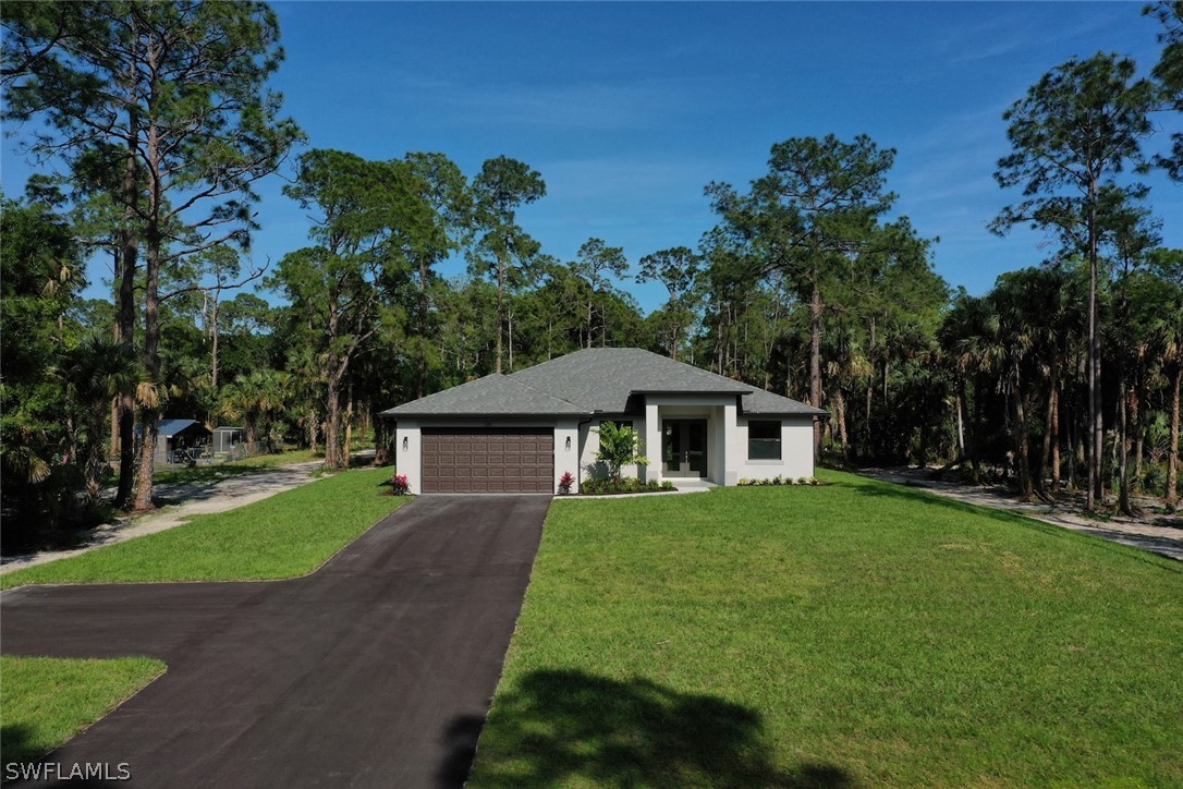 a view of a house with a yard