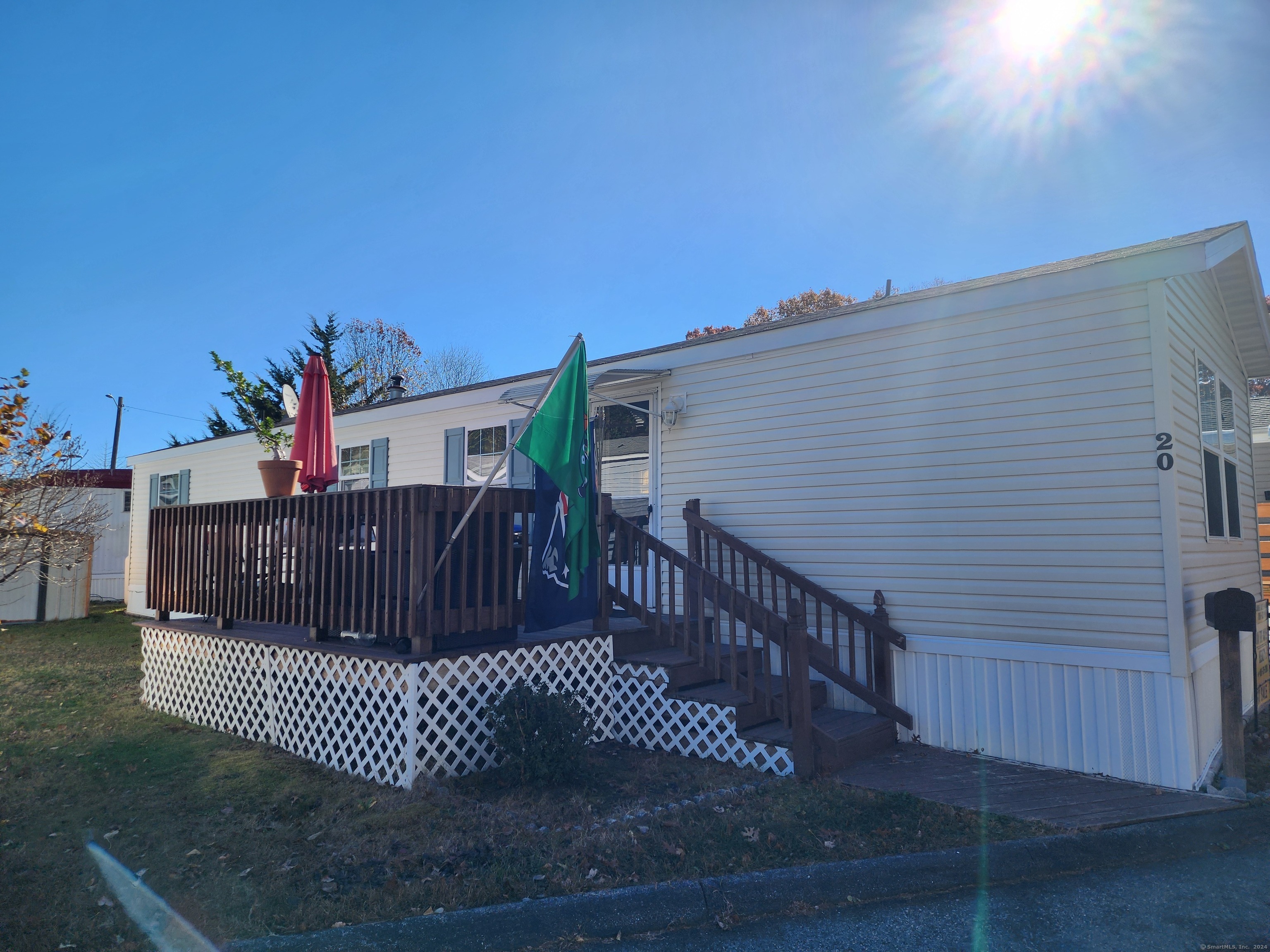 a view of a roof deck with wooden fence