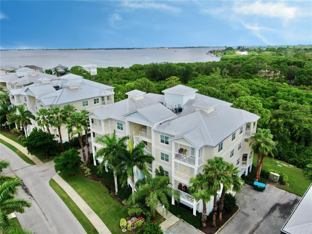 a aerial view of a house with a yard and plants