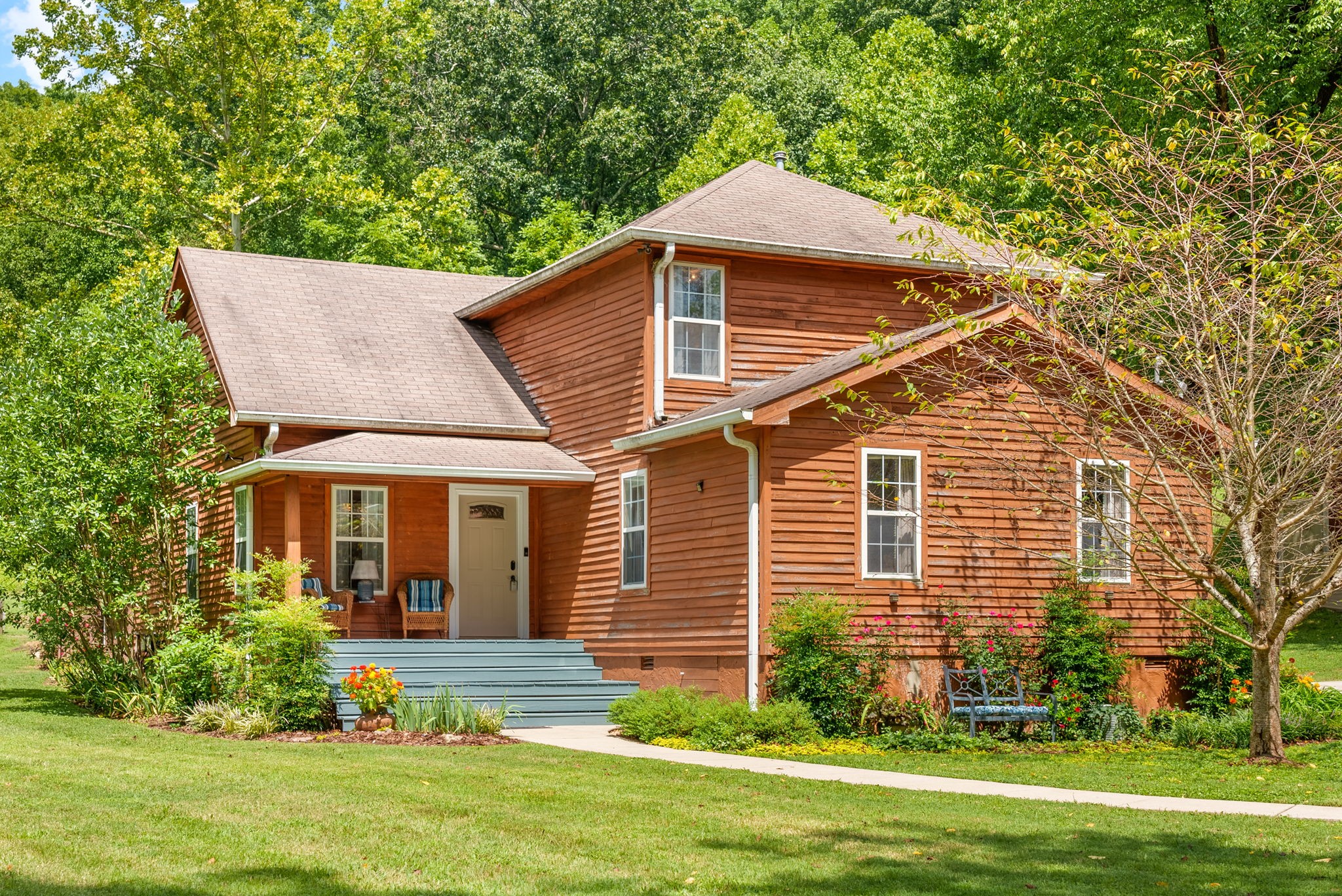 a front view of a house with a yard