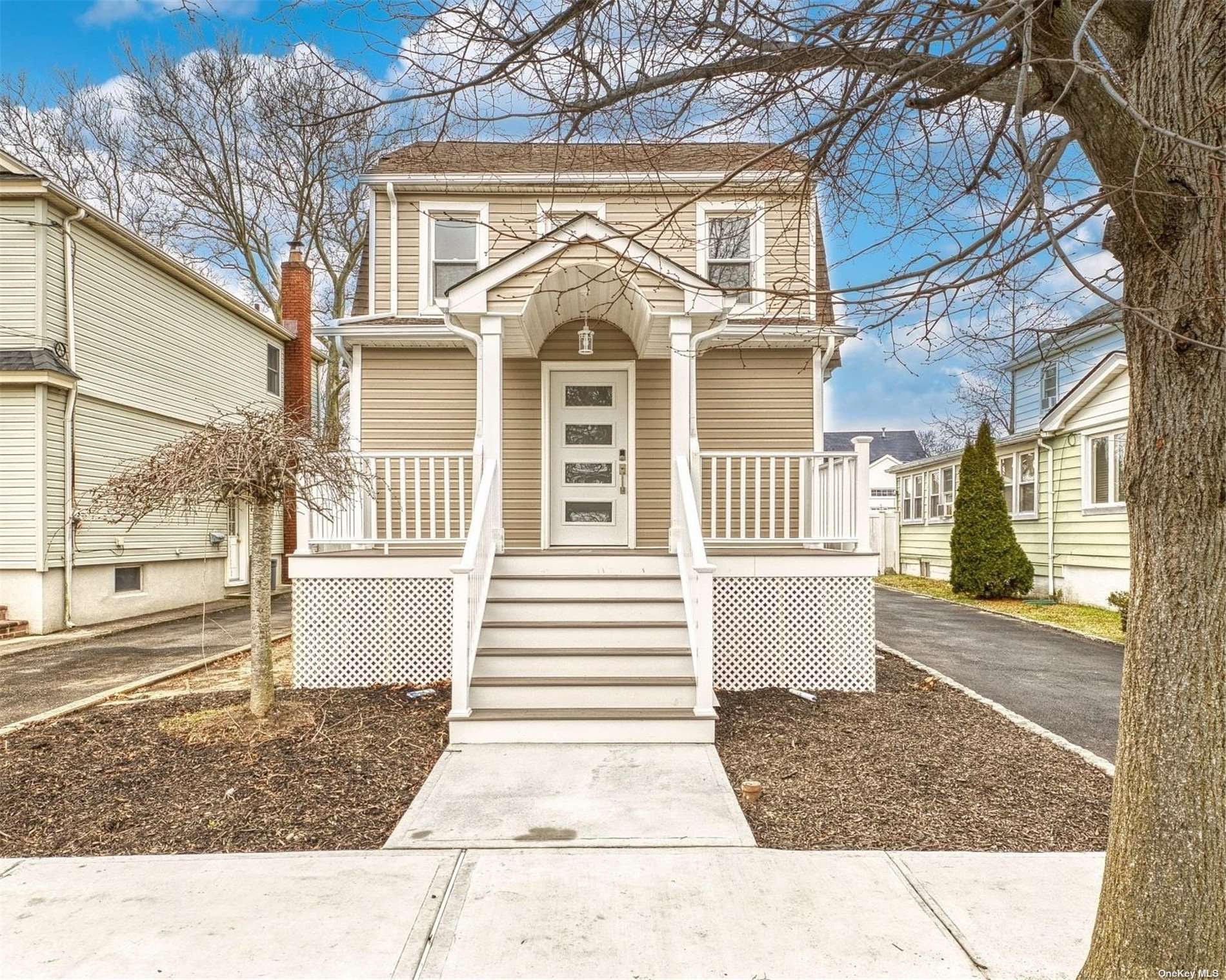 a front view of a house with a porch