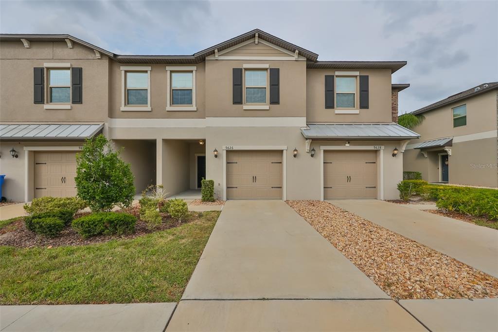 front view of a house with a yard