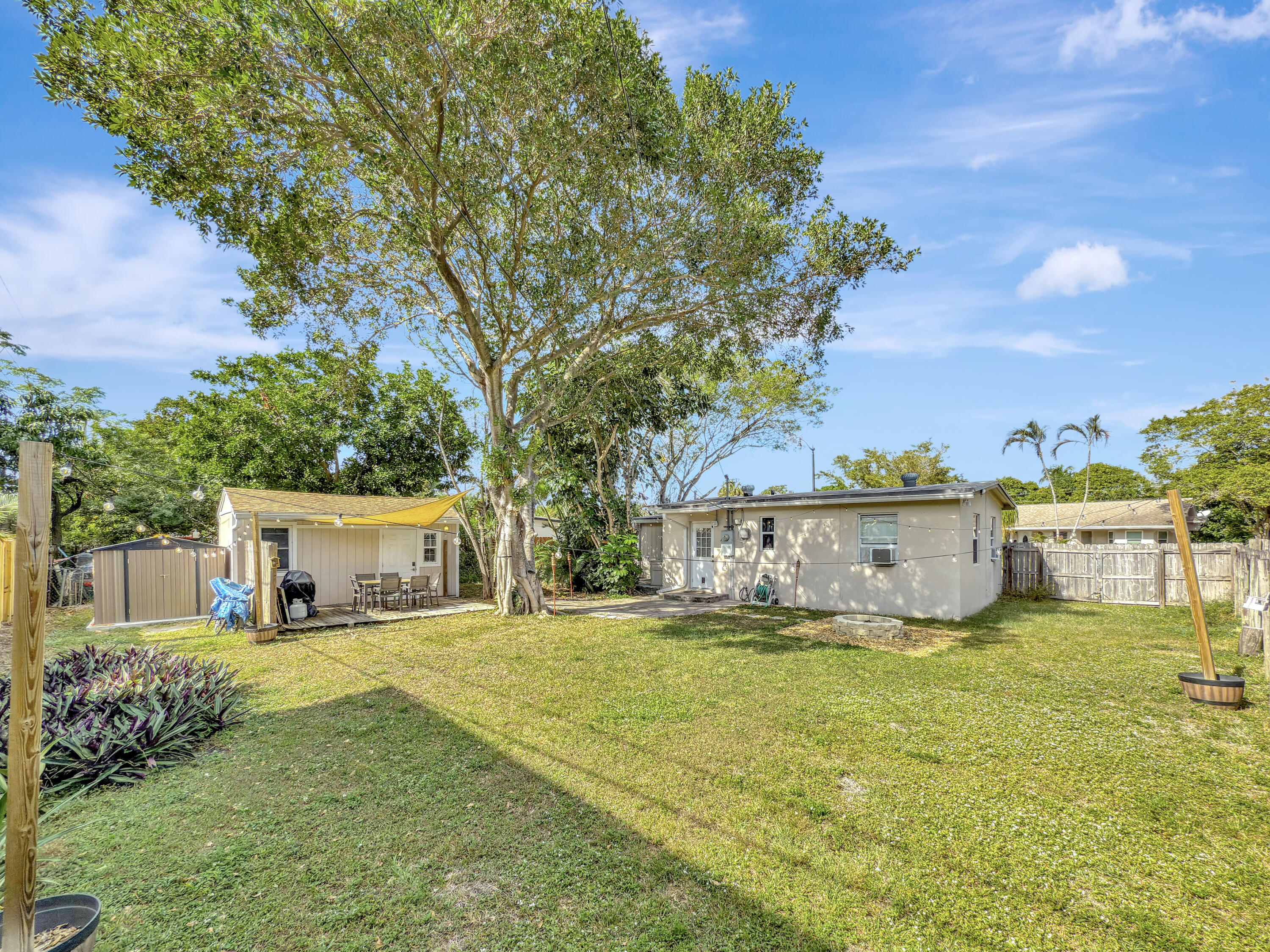 a view of a house with yard and sitting area