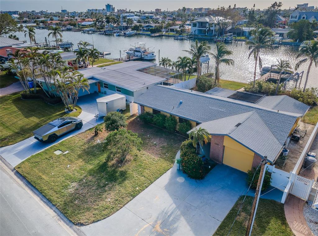 an aerial view of a house with a lake view