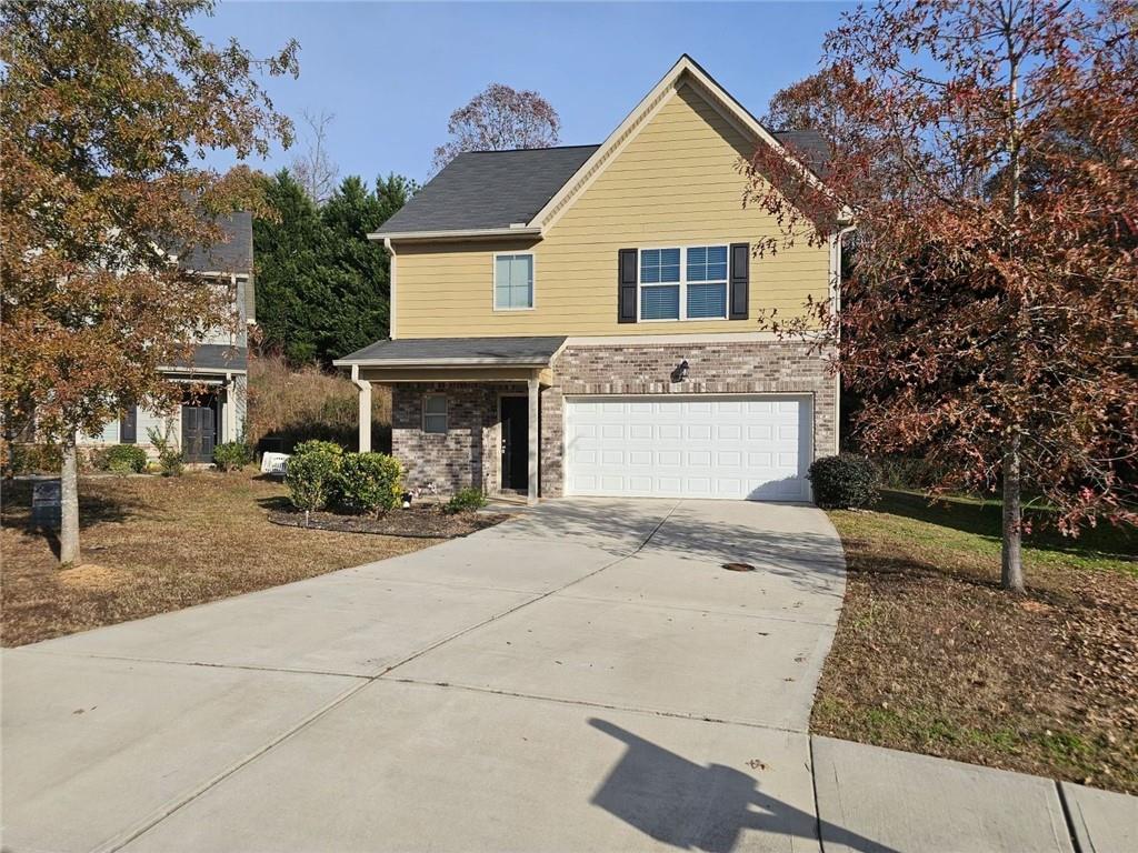 a front view of a house with yard