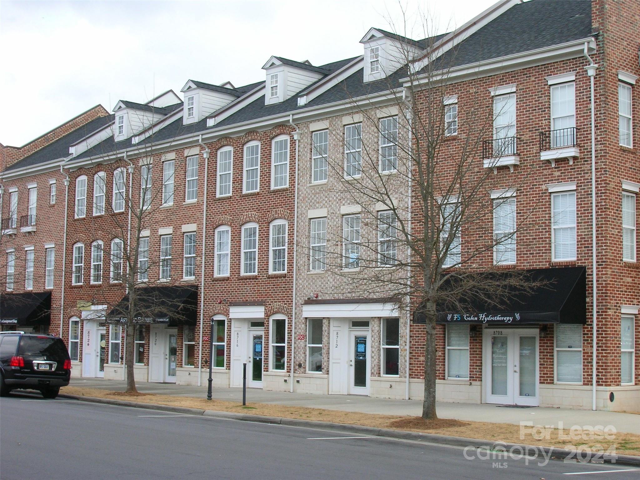 a view of a building with a street