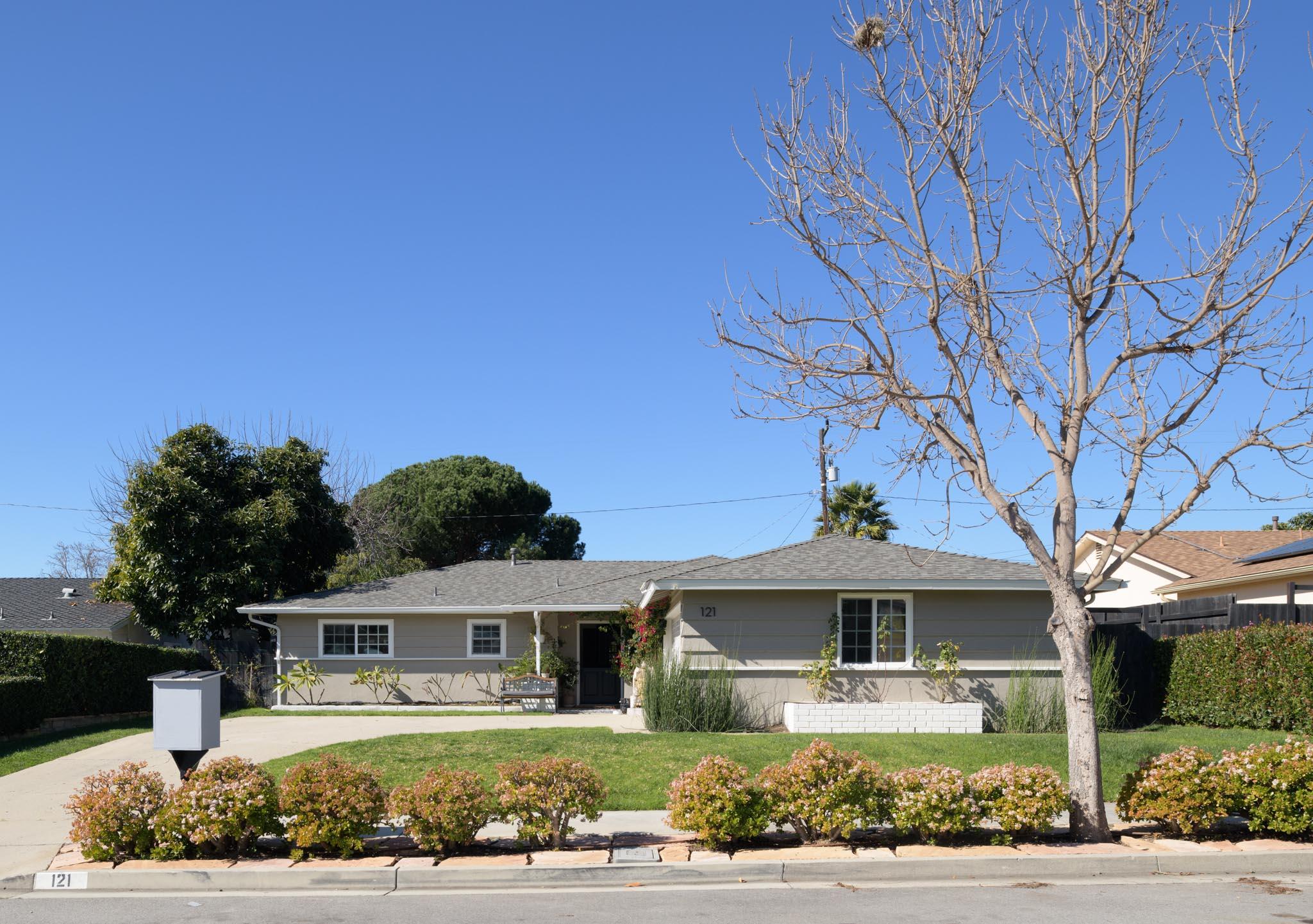 a front view of a house with garden