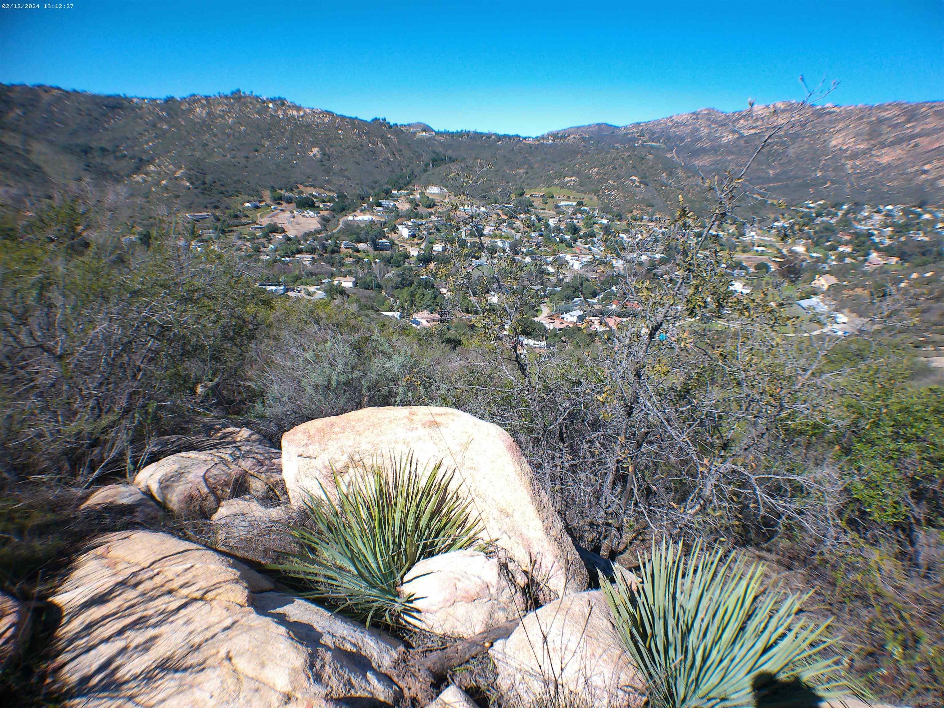 a view of a house with a mountain in the background