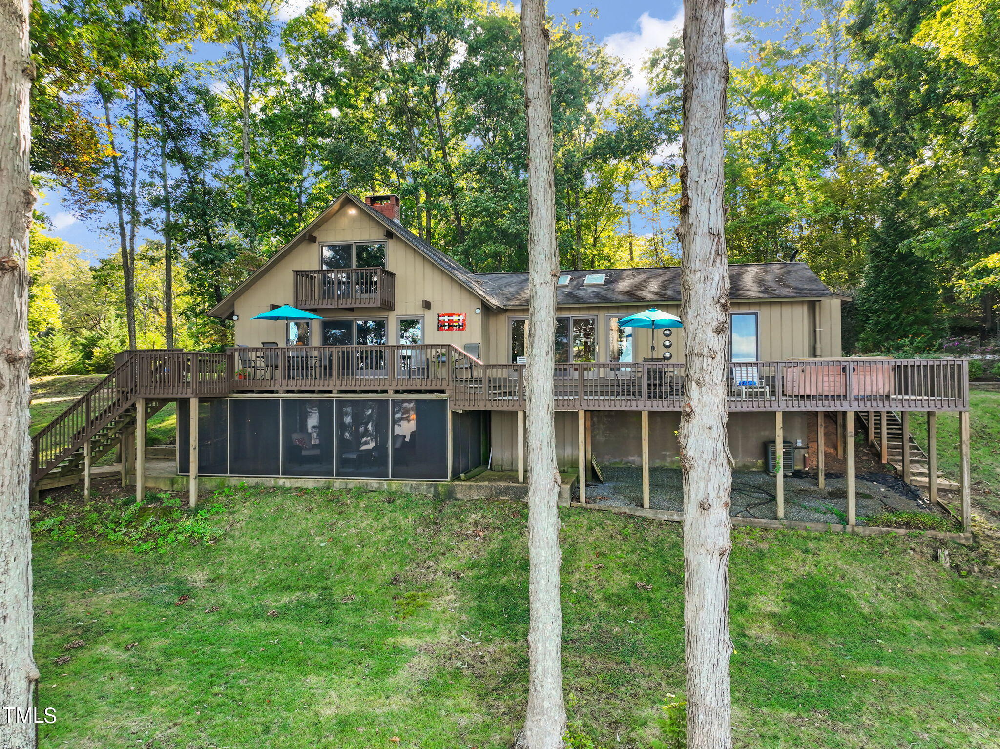 a view of a house with a yard and sitting area