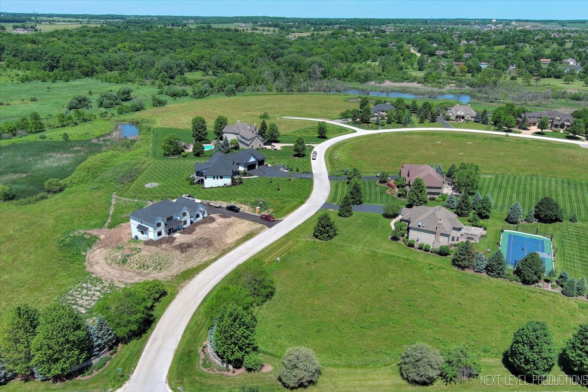 an aerial view of a golf course with lots of trees