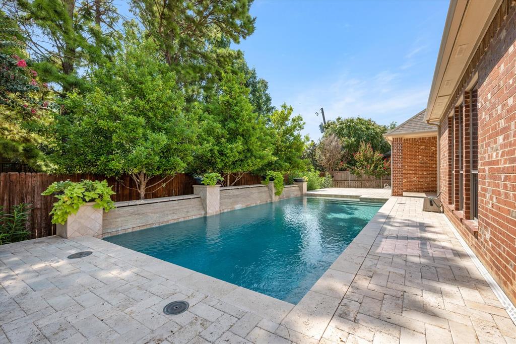 a view of a patio with swimming pool