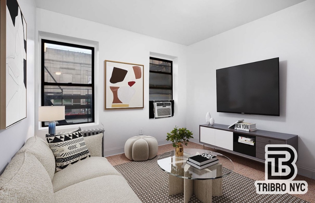 a living room with furniture a flat screen tv and a window