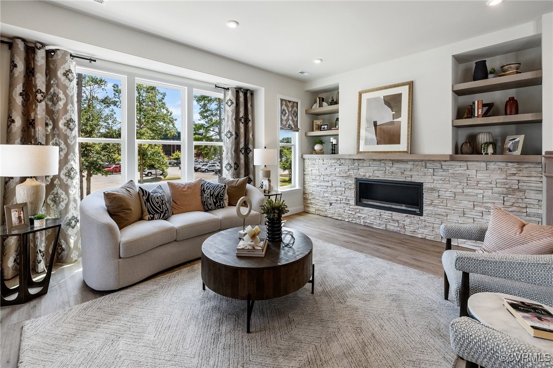 a living room with furniture and a fireplace