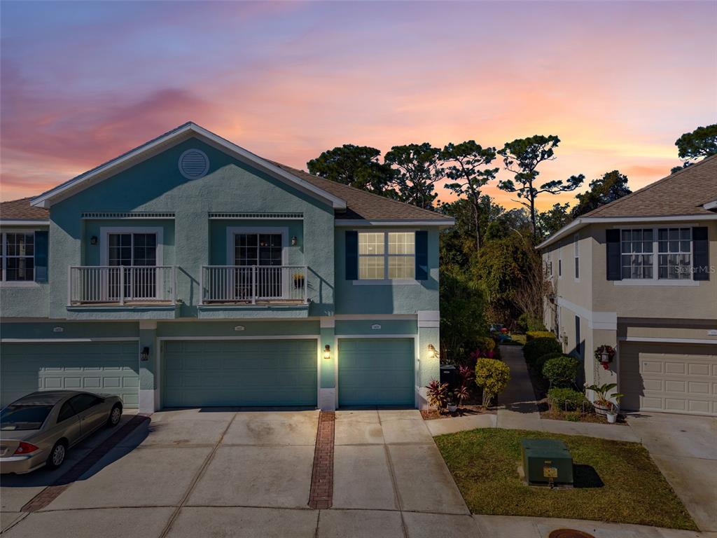 a view of a house with a kitchen outdoor seating area and furniture