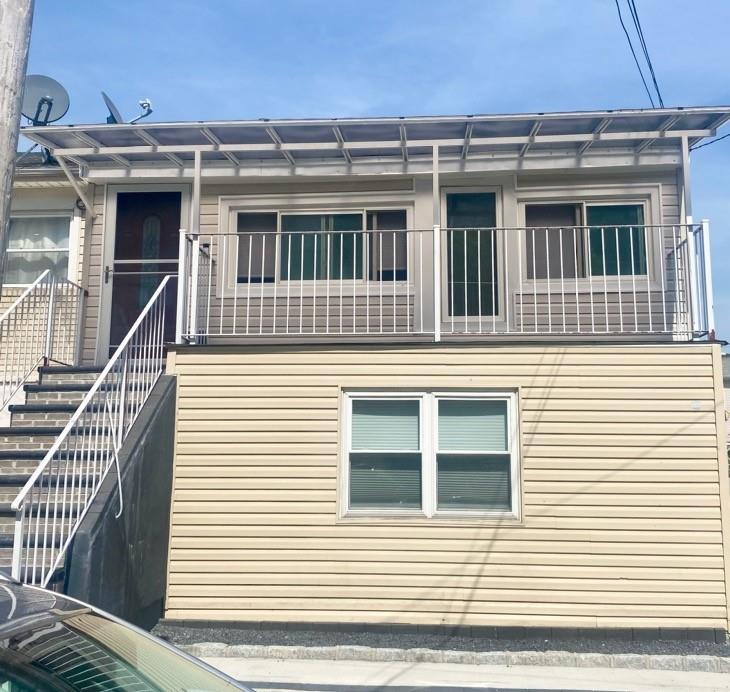 View of property exterior with a balcony