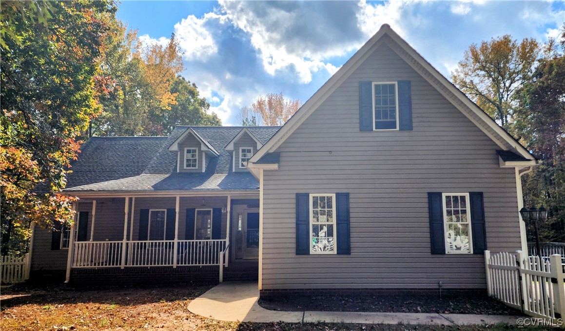 View of front of home featuring covered porch