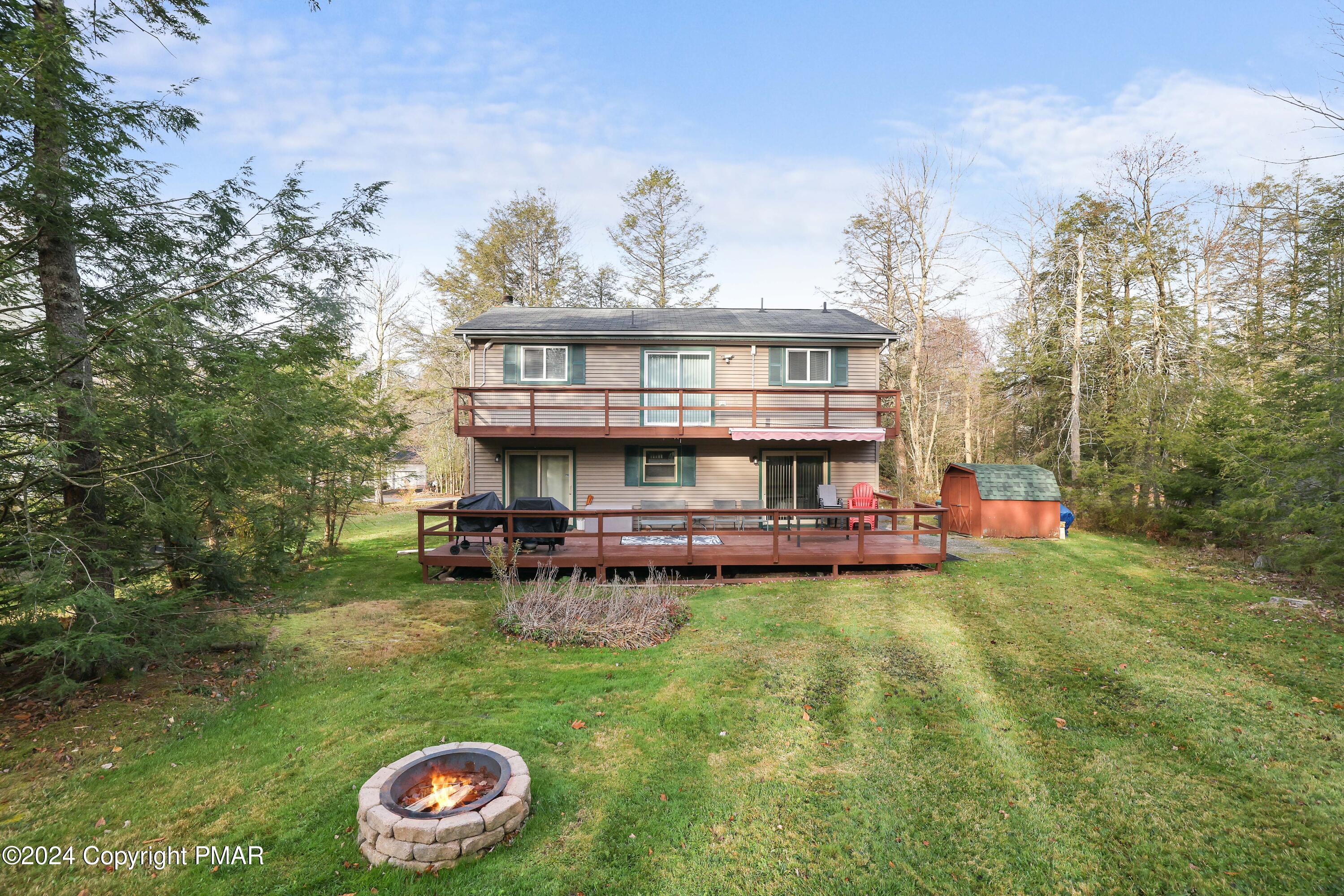 a view of a house with a yard porch and sitting area