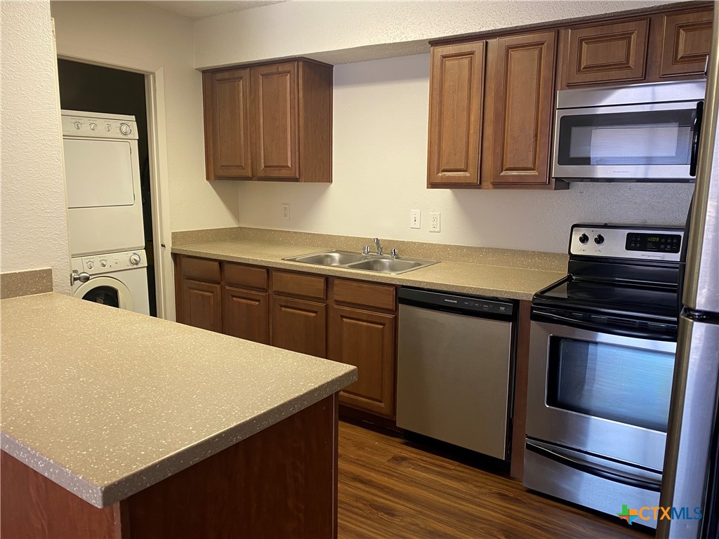 a kitchen with a stove and a microwave