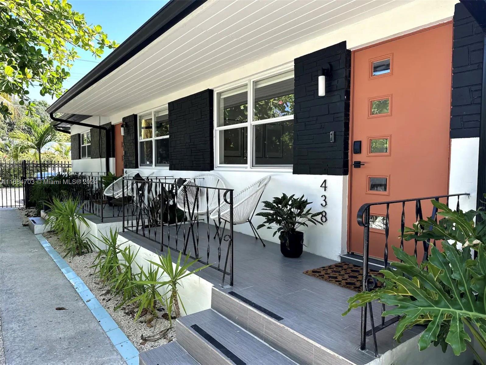 a view of a chairs and table in the patio