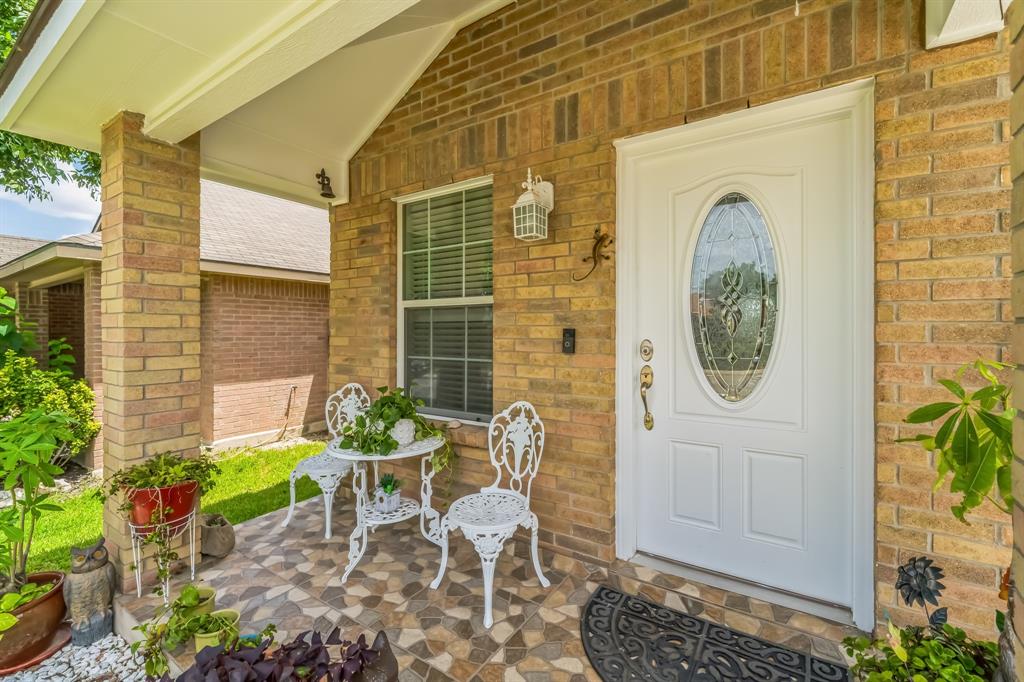 a front view of a house with outdoor seating