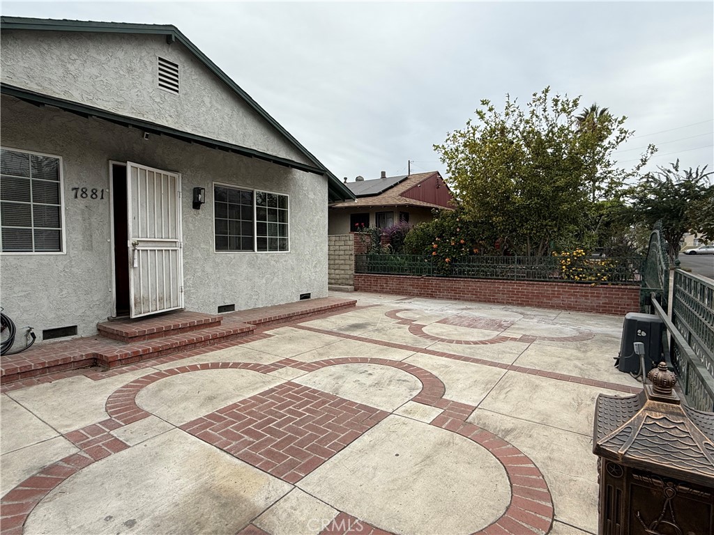 a backyard of a house with yard and outdoor seating