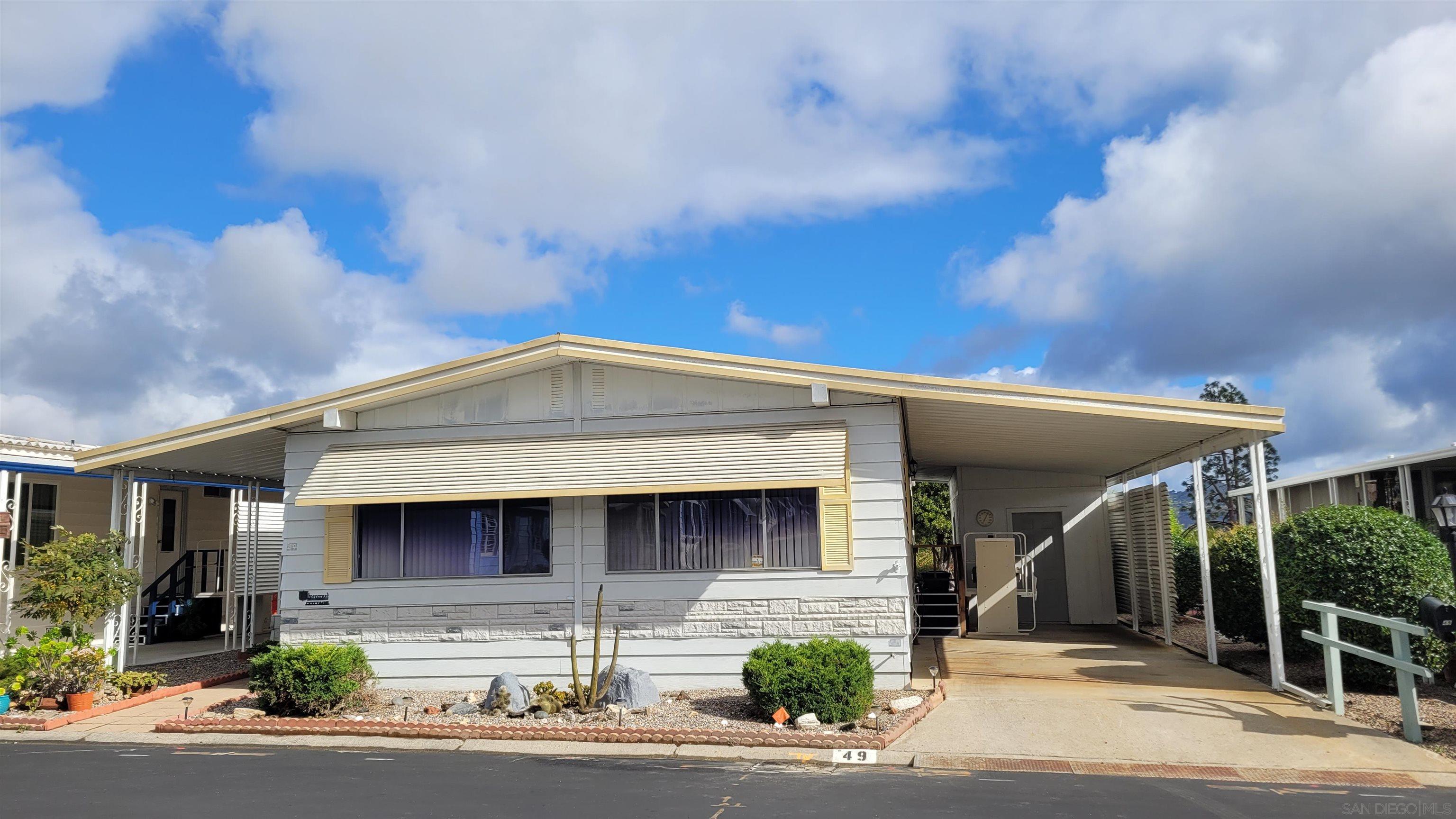 a front view of a house with garage