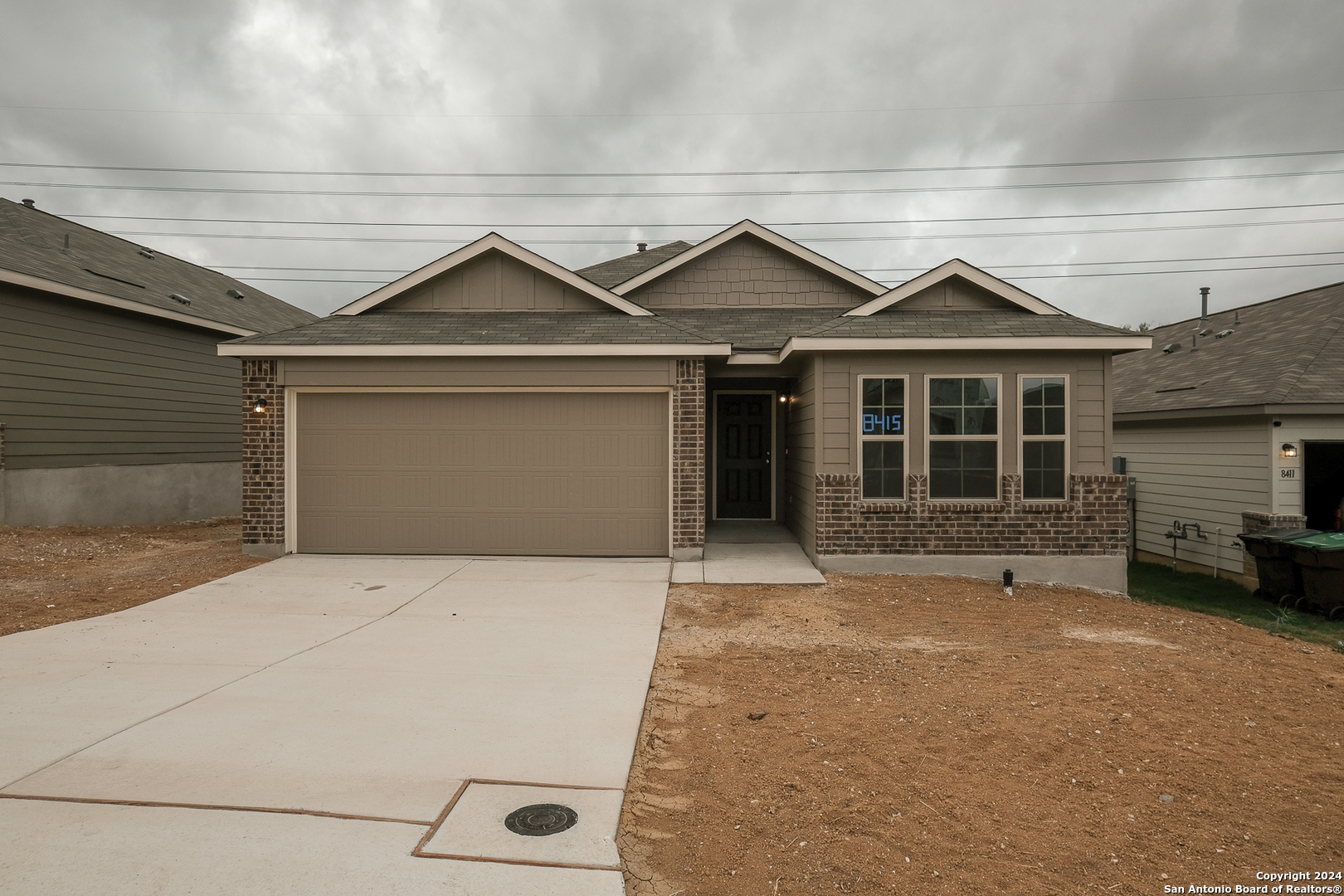 a front view of a house with a garage