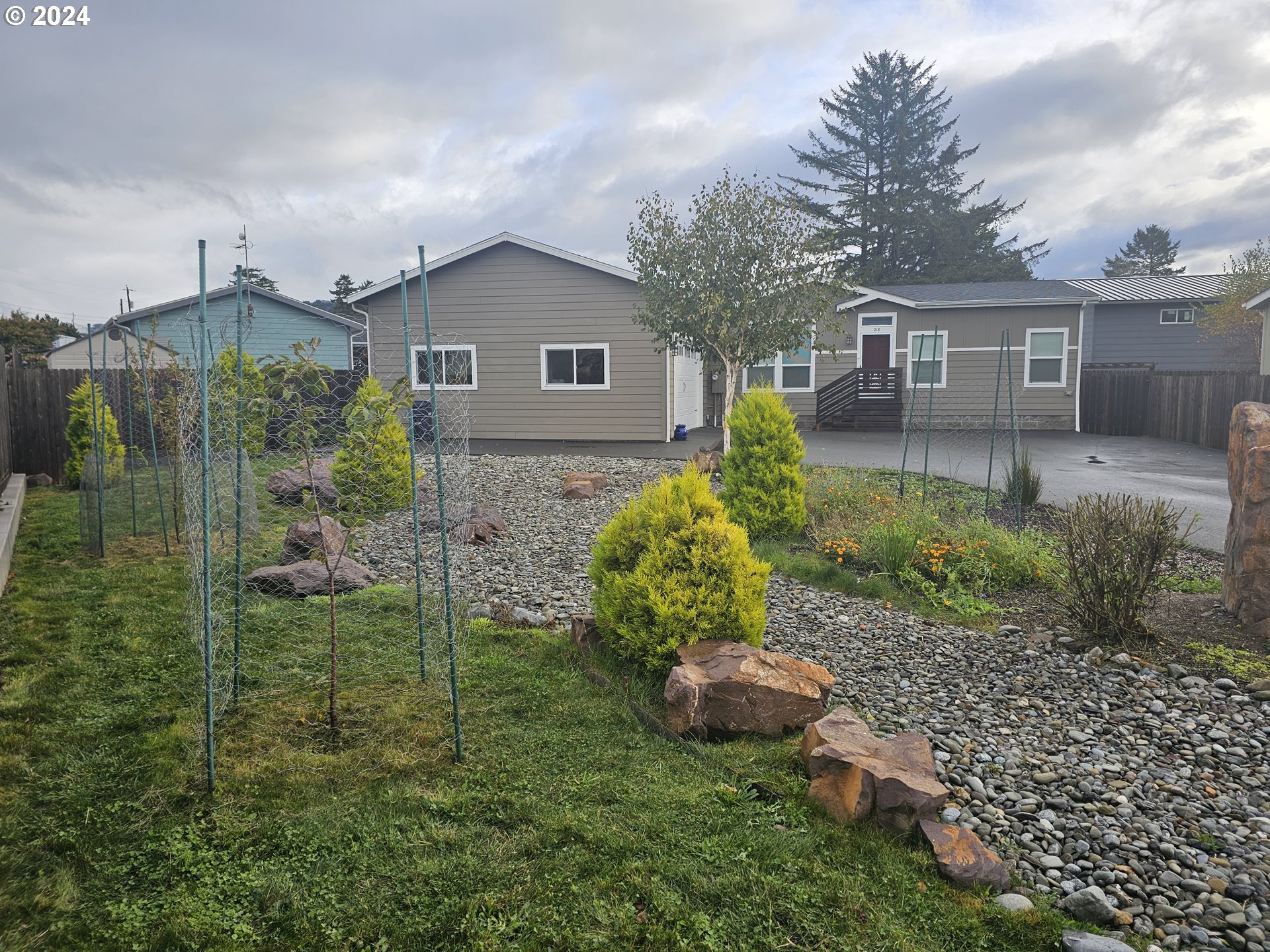 a front view of a house with garden