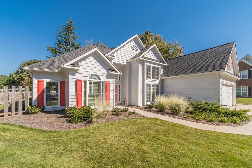 a front view of a house with garden