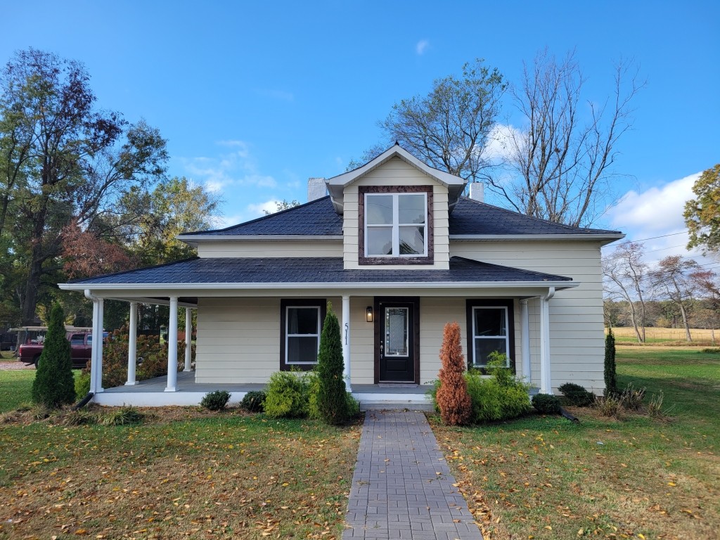 a front view of a house with a yard