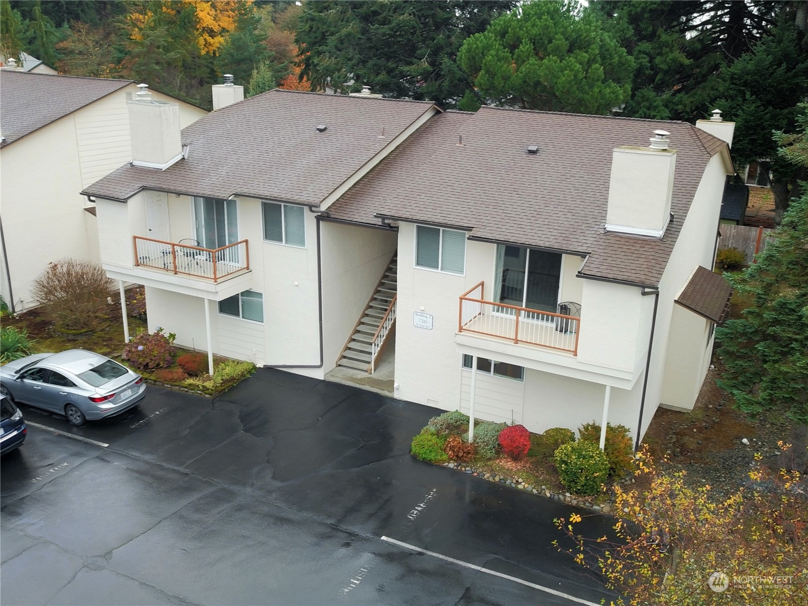 a aerial view of a house with swimming pool and sitting area