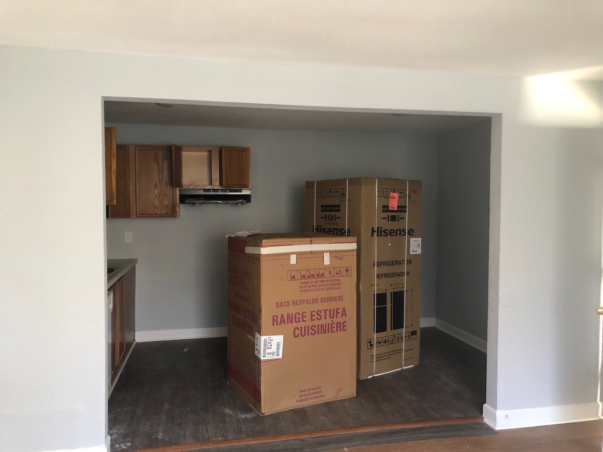 a view of a kitchen from the hallway