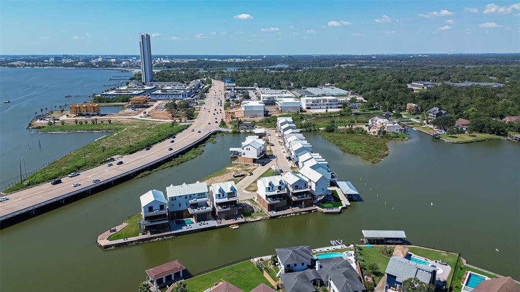 an aerial view of a houses with a lake view