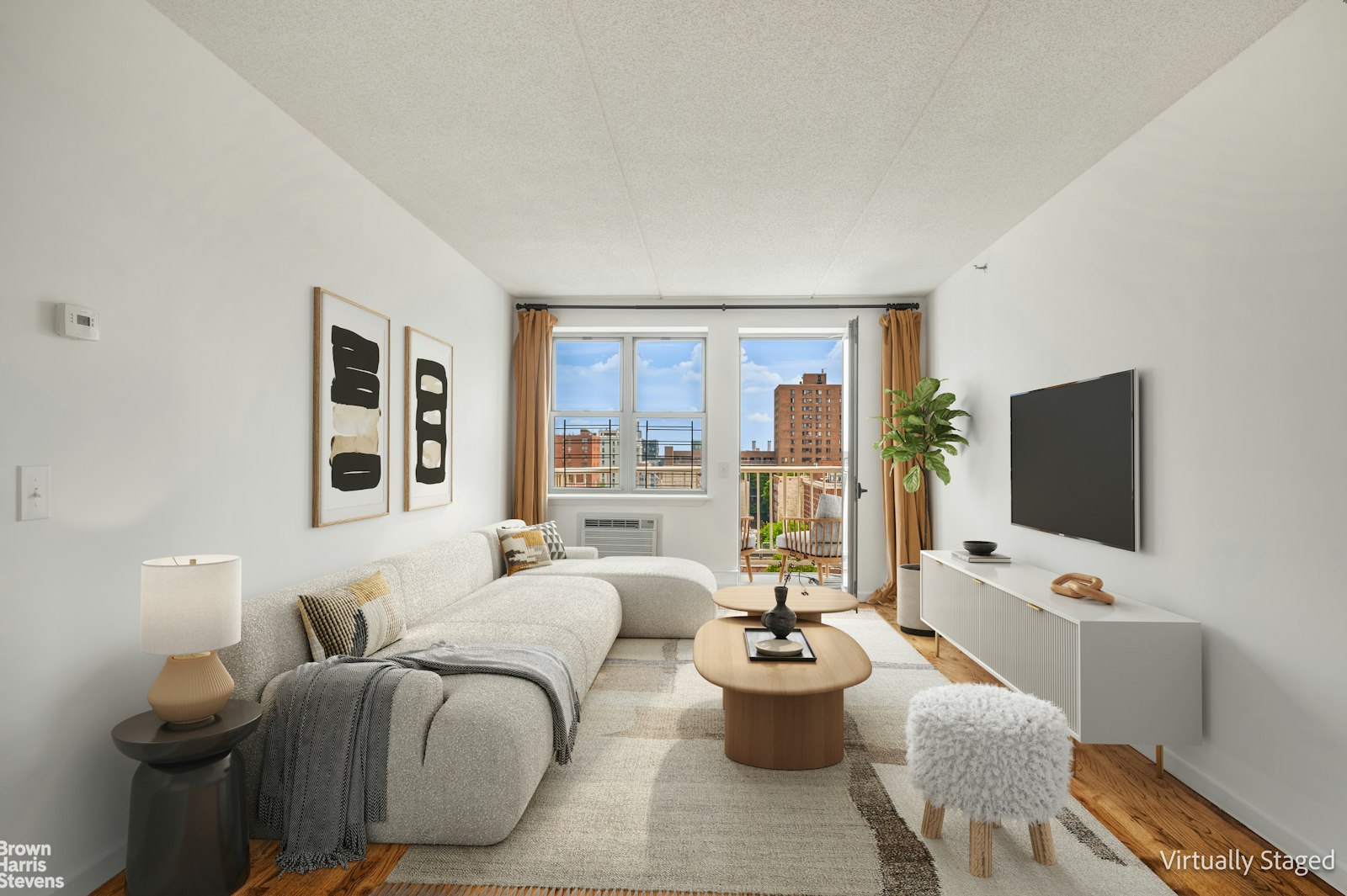 a living room with furniture a flat screen tv and a floor to ceiling window