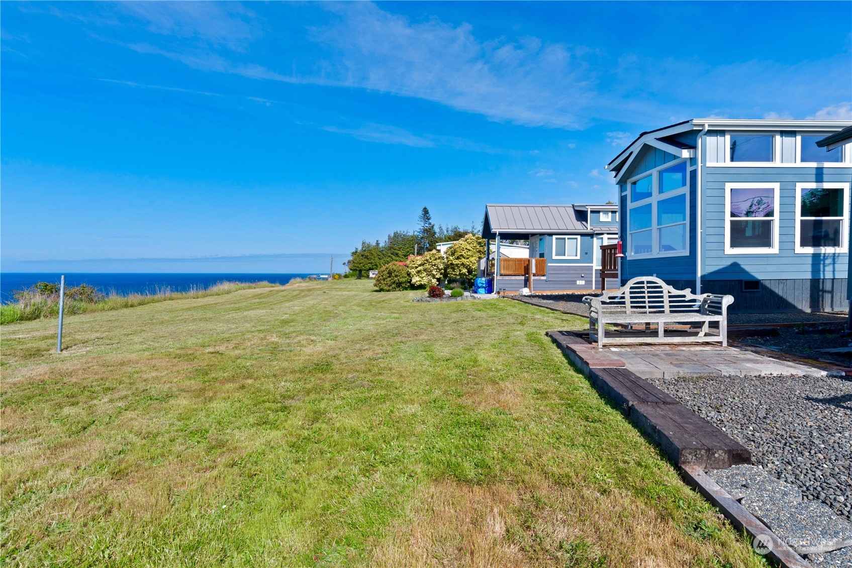 a view of a house with backyard porch and sitting area