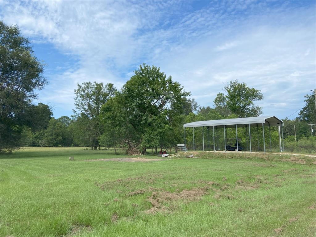 a backyard of a house with lots of green space