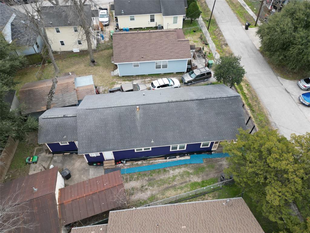 an aerial view of a house with outdoor space