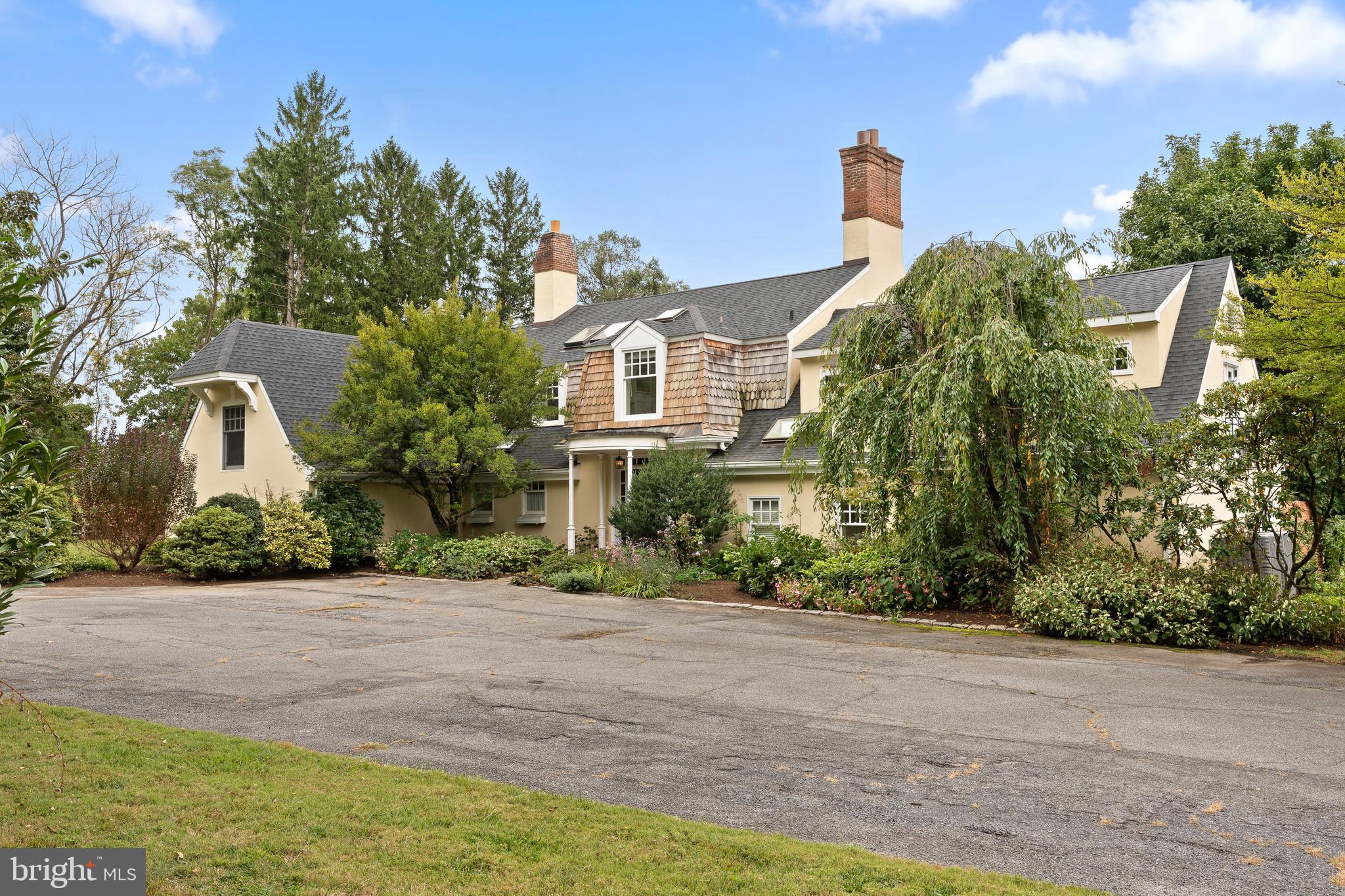 a front view of a house with a yard and a garage