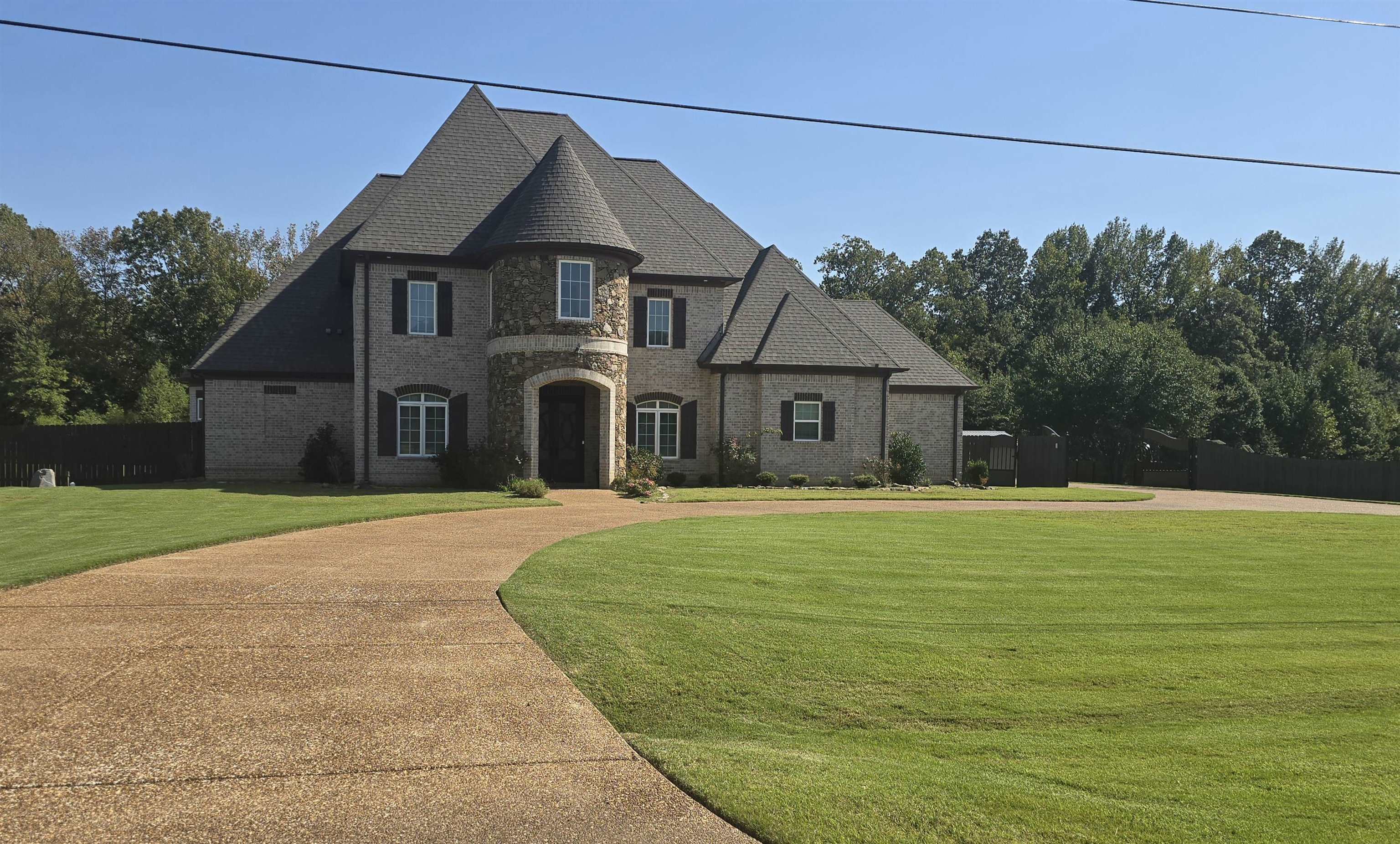 View of front of property with a front lawn