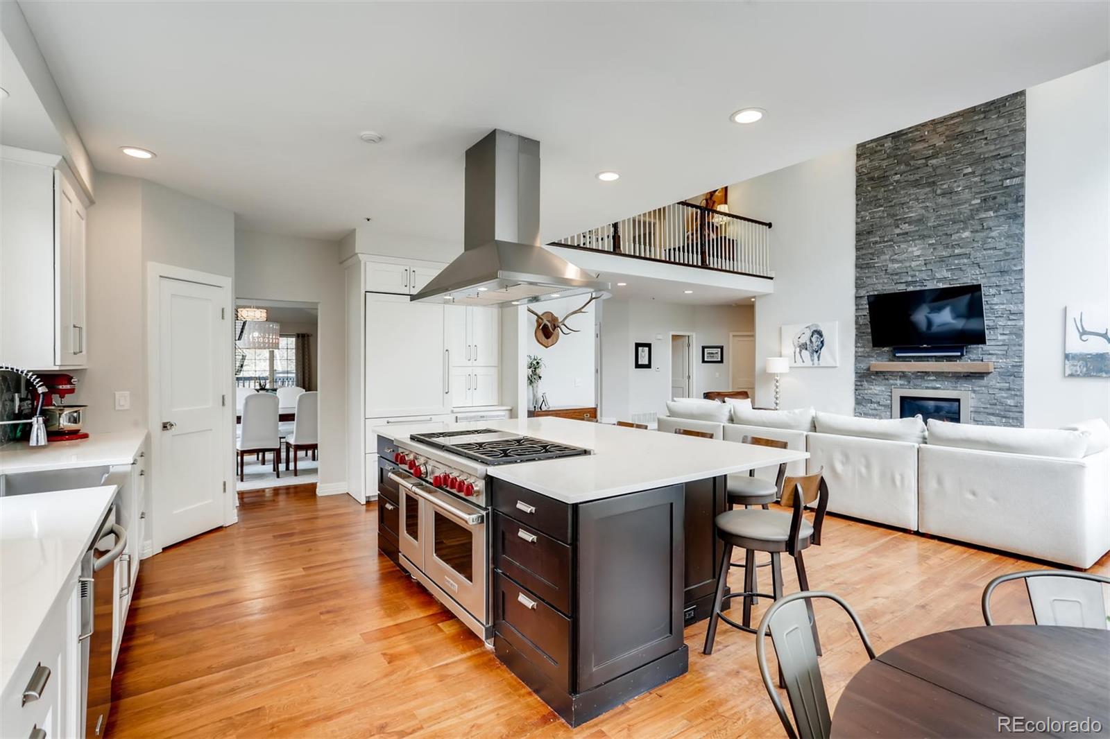 a kitchen with a stove and a refrigerator