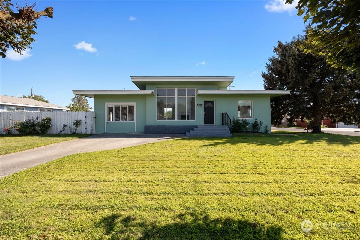 a view of house with swimming pool outdoor seating