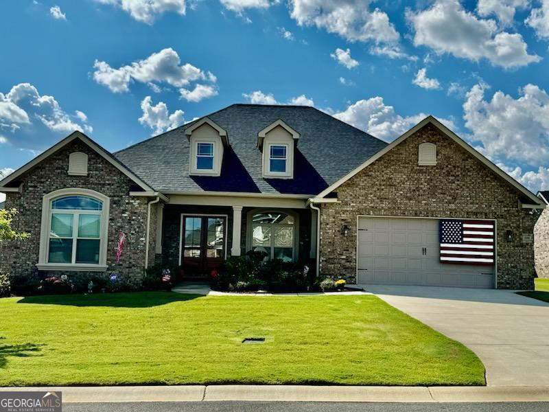 a front view of a house having yard