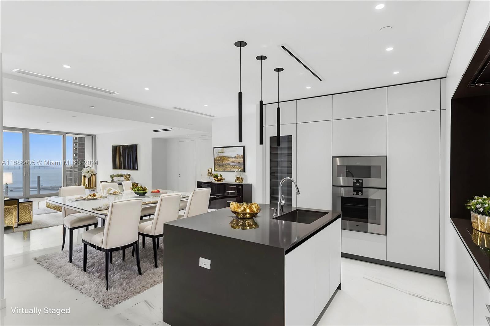 a large kitchen with a table and chairs