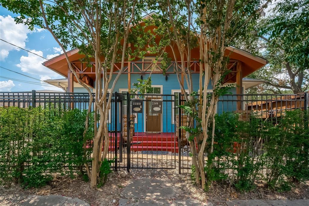 a view of a house with a tree